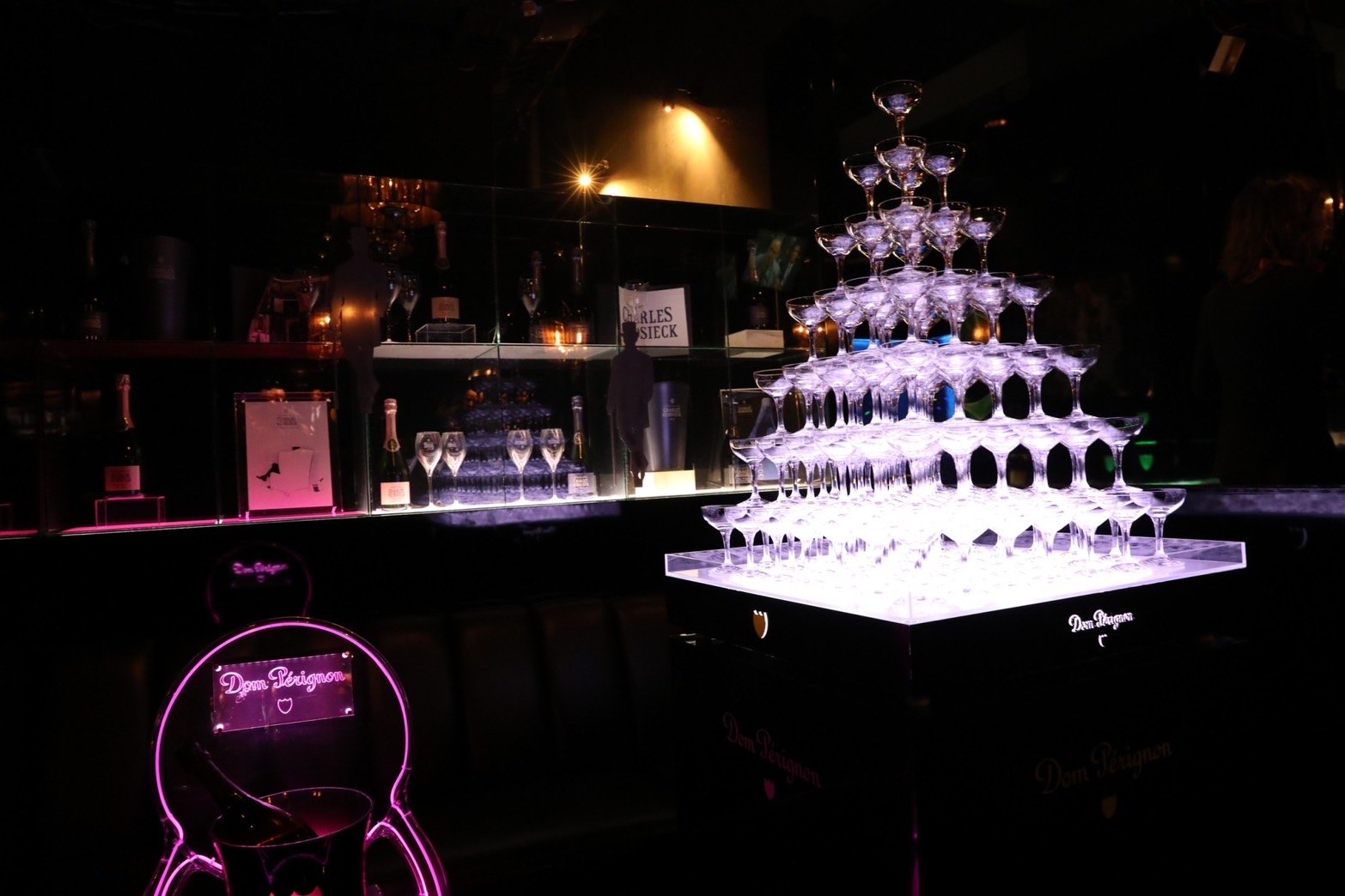 An illuminated champagne tower inside a Tokyo nightlife venue